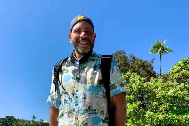 Mo Nasor is radiant as he stands in a beautiful tropical location