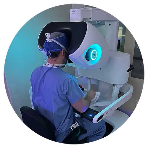 Male using robotic surgery equipment